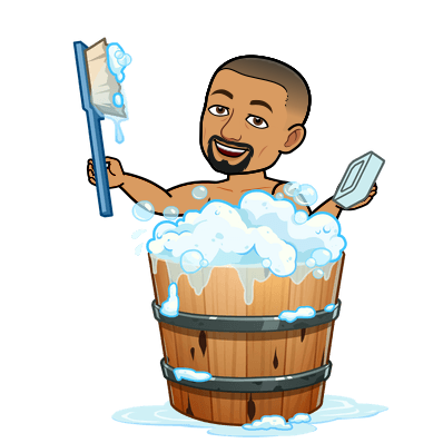 Cartoon man smiling while taking a bubble bath in a wooden tub, holding a large brush in one hand and a bar of soap in the other.