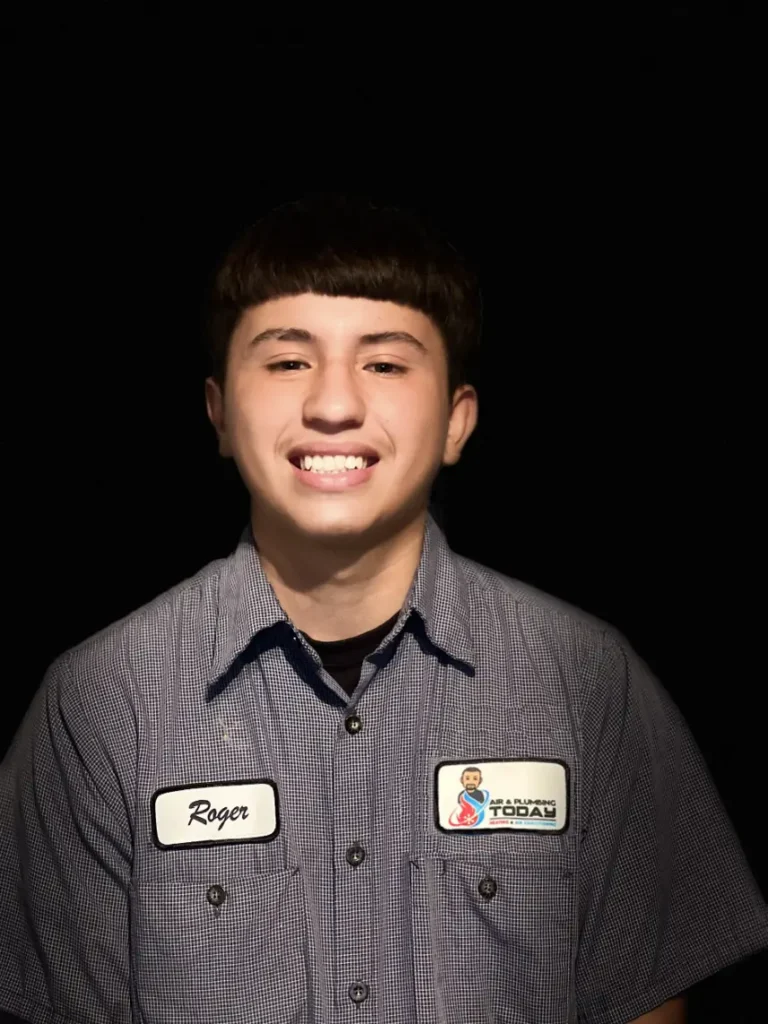 A young man wearing a work shirt with a "Roger" name tag and a "Rooter Today" logo, smiling against a plain black background, ready to help you learn more about us.