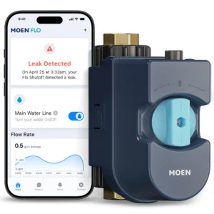 A smartphone screen shows a leak detected alert from the Moen Flo app next to a Moen Flo smart water shutoff device.